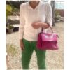 sac cuir rose ailes, porté